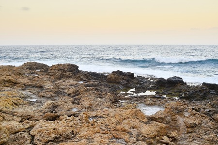 Deserted shore of the island during the surf. Background.の写真素材