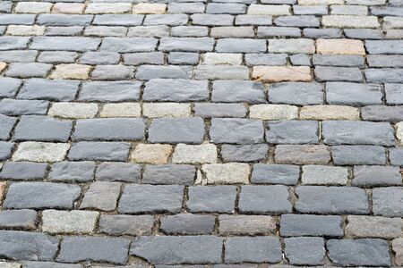 Old paving stones close- up of rectangular stone bricks. Textured background.の写真素材
