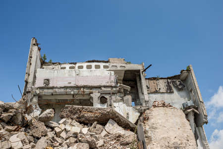 Grey concrete fragments of the buildings Foundation against a clear blue sky. Backgroundの写真素材