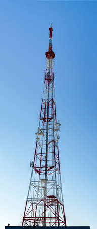 panorama. Telecommunications tower on a blue clear sky background. background.の写真素材