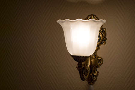Blur. Old vintage lamp on the wall in frosted glass and muted light. Backgroundの写真素材