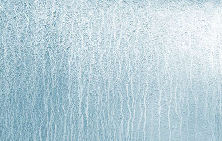 The flowing streams of water are blue with a gradient of light. background.の写真素材