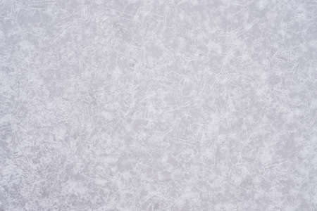 Abstract gray three-dimensional natural background of frozen glass in a white glow patterns of cracks, air bubbles and drops. unfiltered.の写真素材