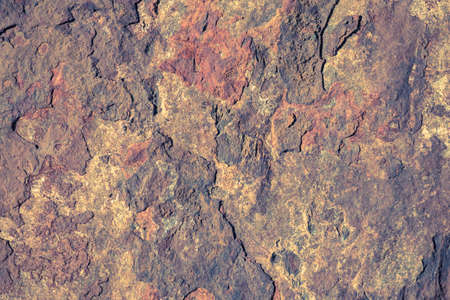 Rough texture of the stone with iron oxides and flaking fragments. background.の写真素材