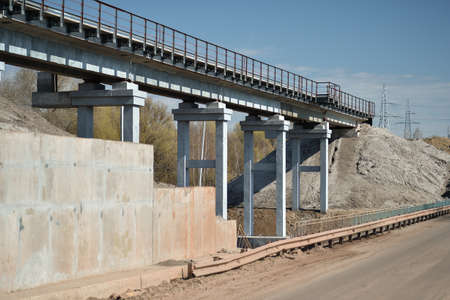 The new bridge on the background of the blue spring sky with a part of the highway in the foreground. background.の写真素材