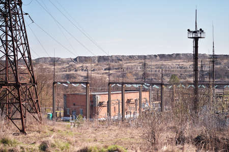 Electric substation for mining quarries and mines on the background of a desert landscape of rock dumps. background.の写真素材