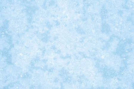 Blue ice in the natural effect of a haze of white frost. Natural backgroundの写真素材