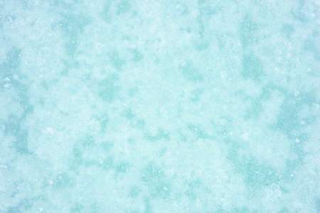 Blue ice with a barely turquoise tint in the natural effect of a haze of white frost. Natural backgroundの写真素材