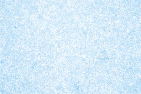 Blue ice thickly covered with white frost. Natural backgroundの写真素材