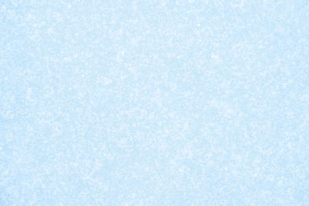 Pale blue ice in a luminous white frost. Natural backgroundの写真素材