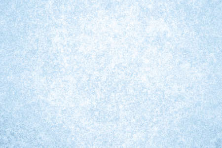 A pattern of glowing white frost on blue ice. Natural backgroundの写真素材