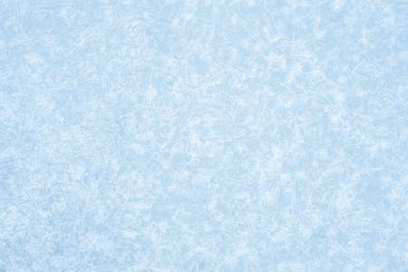 Pale blue ice in an openwork pattern of brightly glowing ice veins. Natural background. Backgroundの写真素材