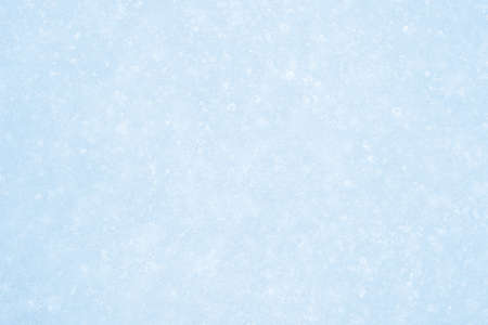 Pale blue ice is textured with a luminous curly pattern of ice veins in white frost. Backgroundの写真素材