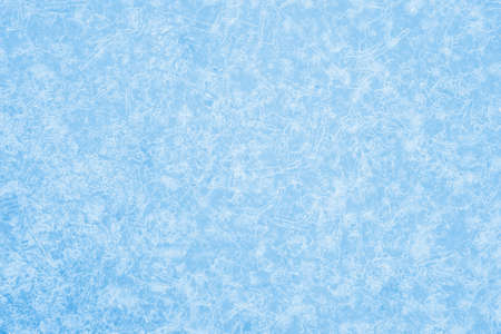White openwork pattern of ice veins and frost on a blue background in uniform light. Backgroundの写真素材