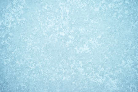 White and blue ice pattern with a minimal turquoise shade of ice in the frost. light airy background.の写真素材