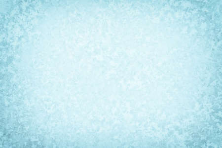 The texture of ice in crystal frost with natural illumination in the form of a frame. The concept of a winter background for a flat layer design.の写真素材