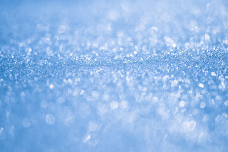 Luminous blue ice bokeh with a mirror reflection effect. Background. Selective focusの写真素材