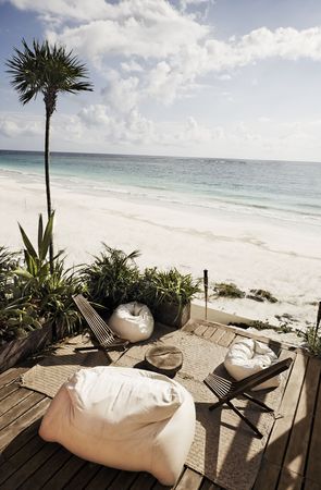 terrace of a cabana with a view of the beautiful white sand beach of tulum in yucatan mexico