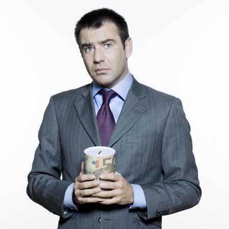 expressive portraits on isolated white background of a handsome  businessman on stock market crisisの写真素材