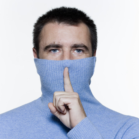 expressive portrait on isolated background of a handsome man,の写真素材