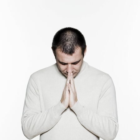 Portrait of an handsome expressive man in studio on white isolated backgroundの写真素材