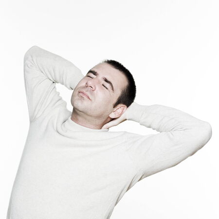 Portrait of an handsome expressive man in studio on white isolated backgroundの写真素材