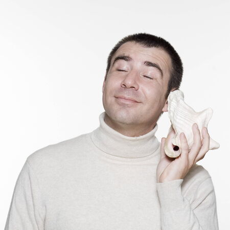 Portrait of an handsome expressive man in studio on white isolated background