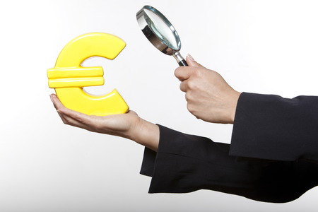 portrait expressive woman isolated background surveying euroの写真素材