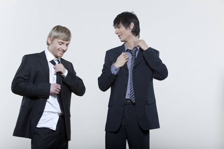 two male expressive young men on isolated backgroundの写真素材