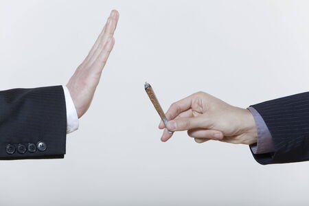 one hand stop gesture no to drugs cannabis marijuana cigarette isolated backgroundの写真素材