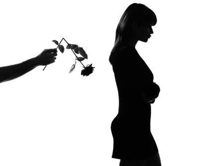 man hand offering a flower rose  stylish sexy silhouette caucasian beautiful woman on studio isolated white backgroundの写真素材