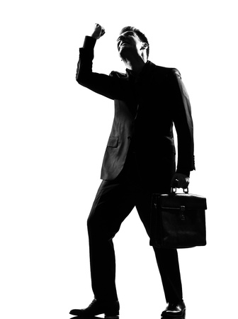 silhouette caucasian business man  expressing anger adversity despair looking up behavior full length on studio isolated white backgroundの写真素材
