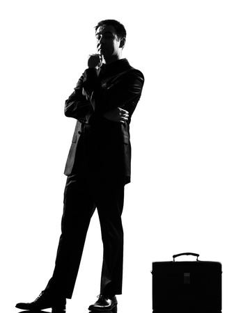 silhouette caucasian business man thinking pensive behavior full length on studio isolated white backgroundの写真素材