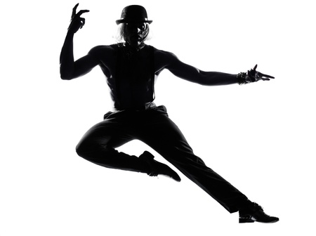 one  african man dancer dancing cabaret burlesque on studio isolated white backgroundの写真素材