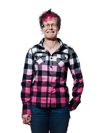 Portrait of a young expressive woman crying in studio on white isolated backgroundの写真素材