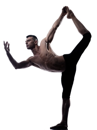 caucasian Man yoga asanas natarajasana dancer pose gymnastic  stretching acrobatics isolated studio on white backgroundの写真素材