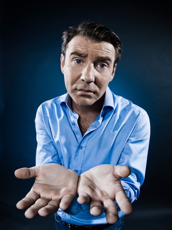 caucasian man begging despair portrait isolated studio on black backgroundの写真素材