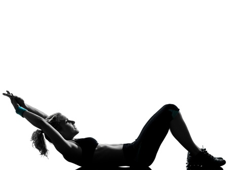 one woman exercising workout fitness aerobic exercise abdominals push ups posture on studio isolated white backgroundの写真素材