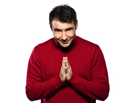 caucasian man gesture saluting joined hands in the indian way studio portrait on isolated white backgoundの写真素材