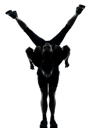 one couple man woman exercising workout aerobic fitness posture full length silouhette on studio isolated on white backgroundの写真素材