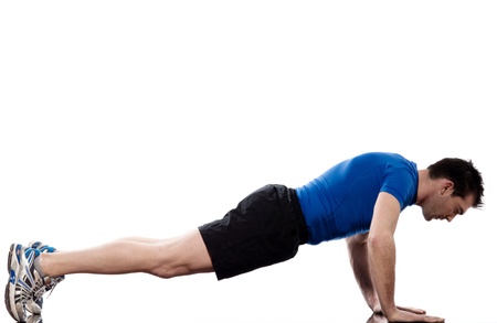 man doing push up abdominals workout posture on isolated white background