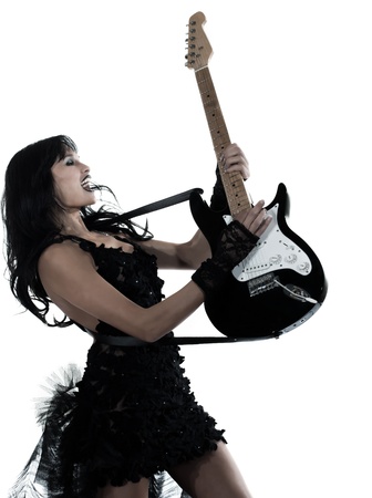one woman playing electric guitar on studio isolated white backgroundの写真素材