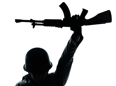 one caucasian revolutionary army soldier man holding ak47 kalachnikov on studio isolated on white backgroundの写真素材