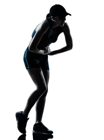 one caucasian woman runner jogger tired breathless in silhouette studio isolated on white backgroundの写真素材