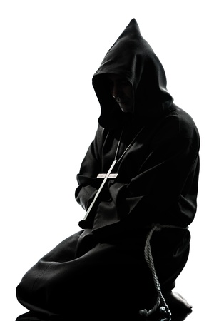 one caucasian man priest praying silhouette in studio isolated on white backgroundの写真素材