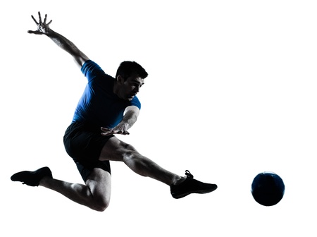 one caucasian man flying kicking playing soccer football player silhouette in studio isolated on white background one caucasian man flying kicking playing soccer football player silhouette in studio isolated on white background