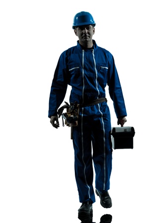 one caucasian repairman worker silhouette in studio on white backgroundの写真素材