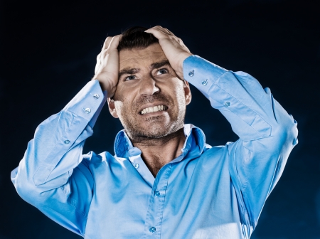 caucasian man despair unshaven portrait isolated studio on black backgroundの写真素材