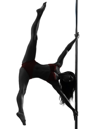 one caucasian woman pole dancer dancing in silhouette studio isolated on white backgroundの写真素材