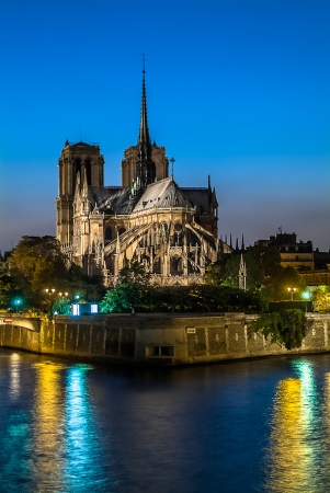 notre dame de paris by night and the seine river France in the city of Paris in franceの写真素材